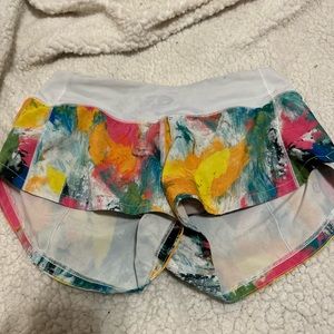 Size 2 lululemon speed ups 2.5”. They are multi color paint stripes.